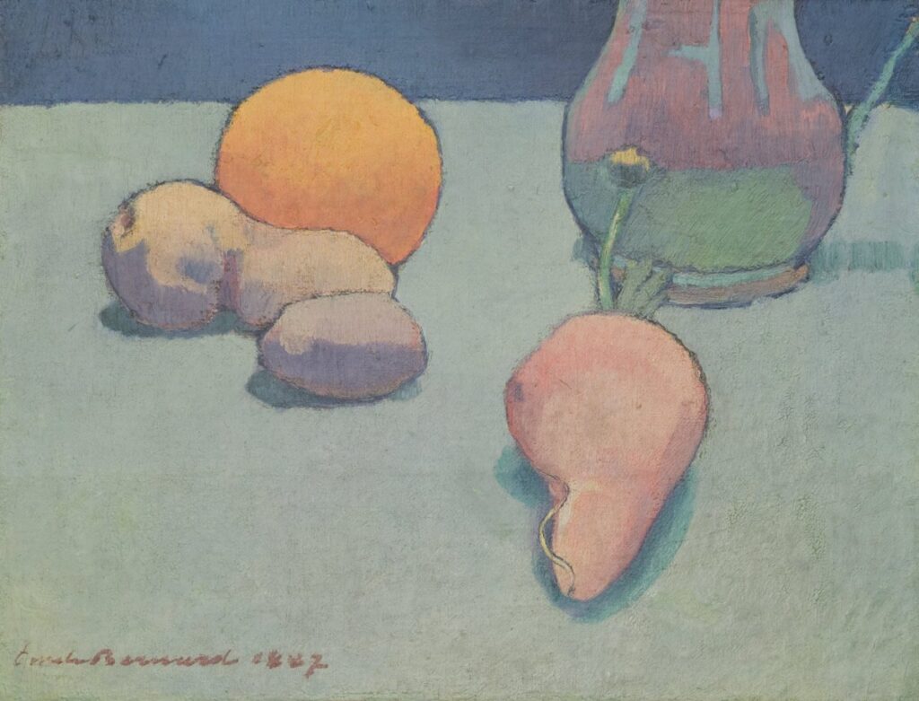 Pears, orange and other fruit sit atop a table.