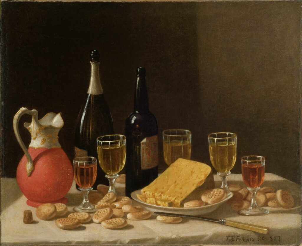 wine bottles, crackers and cheeses.